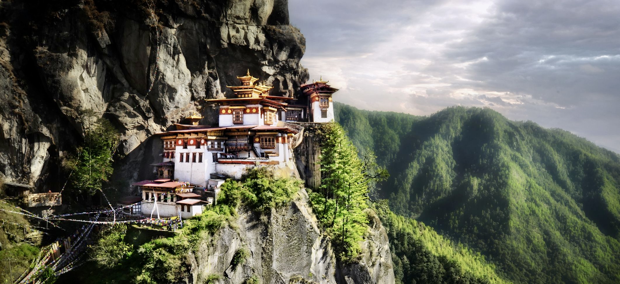 Bhutanese architecture in damphu town with tsirang dzong in the background  on Craiyon